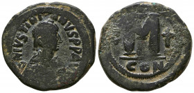 Justinian I. 527-565. Æ Follis . Nicomedia mint, 1st officina. Struck 527-537. Diademed, draped, and cuirassed bust right / Large M; cross above, two ...