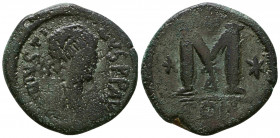 JUSTINIAN I. 527-565 AD. Æ Follis. Constantinople mint, 2nd officina. Diademed, draped, and cuirassed bust right; star on shoulder / Large M, cross ab...