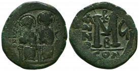 Justin II, with Sophia. 565-578. Æ Follis. Constantinople mint, 2nd officina. Dated RY 4 (568/9). Nimbate figures of Justin and Sophia seated facing o...