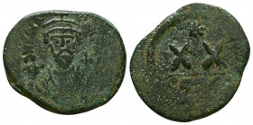 Phocas. 602-610. AE half follis. Constantinople mint. D N FOCA PERP AVG, crowned bust facing wearing consular robes and holding mappa and cross / Larg...