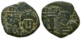 Justin II. 565-578. Æ Decanummium . Theoupolis (Antioch) mint, 3rd officina. Dated RY 1 (565/6). Helmeted and cuirassed bust facing, holding Victory o...