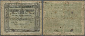 Ceylon: 10 Shillings 18xx (1865) remainder without signatures and date inscription, rare note in stronger used condition with lots of stain, folds and...