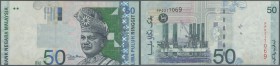 Malaysia: 50 Ringgit ND(1998-2001) P. 43 error print, front print is shiftet as well as the back print, circulated note with light traces of handling,...