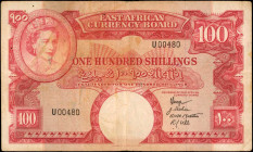 EAST AFRICA. East African Currency Board. 100 Shillings, 1958. P-40. Good.

QEII portrait at top left, with watermark of cat's head at bottom center. ...