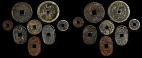 JAPAN. Amulets and Charms (8 Pieces), ND. Grade Range: FINE to VERY FINE.

A group of cast pieces with varying size and shape, all with some mix of ch...