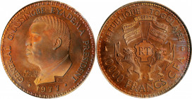 TOGO. Copper 10000 Francs Essai (Pattern), 1977. NGC PROOF-67 Red Brown.

KM-E12. An attractive Proof with flashy fields, frosty devices, and strong m...
