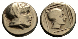 Greek 
LESBOS. Mytilene.(Circa 412-378 BC).
Hekte Electrum
Helmeted head of Ares right. / Head of Amazon right, wearing ornate "helmet"; all within li...