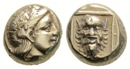 Greek
LESBOS, Mytilene. (Circa 377-326 BC).
Hekte Electrum (9.7mm 2.55g)
Wreathed head of Dionysos right / Head of satyr facing, with full head of hai...