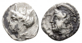 Greek 
CILICIA. Tarsos(?) (circa 4th century BC).
Obol Silver (9.4mm 0.47g)
Bearded and helmeted head left, with drapery around neck. / Female head le...