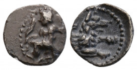 Greek
LYCAONIA, Laranda. (Circa 324/3 BC).
Obol Silver (9.7 mm 0.52 g)
Baal seated left, torso facing, holding grain ear and grape bunch in extended r...