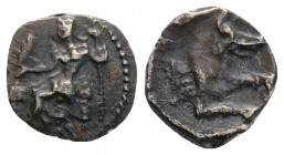 Greek
LYCAONIA, Laranda. (Circa 324/3 BC).
Obol Silver (10 mm 0.44 g)
Baal seated left, torso facing, holding grain ear and grape bunch in extended ri...