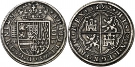 1597. Felipe II. Segovia. 8 reales. (Cal. 231). 26,60 g. Tipo "OMNIVM". Adornos acotando ceca y valor. Pequeño vano en anverso. Rara. MBC.