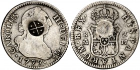1777. Carlos III. Madrid. PJ. 2 reales. 5,73 g. Resello ¿de Sumatra? (Gaceta Numismática 141, pág. 47). Ex Áureo & Calicó 13/03/2008, nº 1216. MBC-....