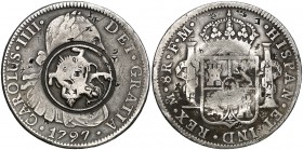 1797. Carlos IV. México. FM. 8 reales. 26,48 g. Varios pequeños resellos orientales en ambas caras, y un gran resello circular de fantasía en el centr...