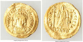 Justinian I the Great (AD 527-565). AV solidus (21mm, 4.24 gm, 6h). XF, wavy flan, scuffs, graffiti. Constantinople, 4th officina, ca. AD 545-565. D N...