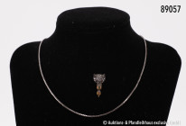 Konv. Silberkette, 835er Silber, L ca. 39 cm, dazu Armband, 333er Gold, L ca. 19 cm, 22,9 g und Anstecknadel mit Fuchskopf-Darstellung mit ca. 25 Diam...