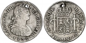 1802. Carlos IV. Santa Fe de Nuevo Reino. JJ. 1 real. (Cal. 1193) (Restrepo 78-38). 3,01 g. Perforación. Rara. (MBC).