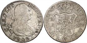 1802. Carlos IV. Sevilla. CN. 8 reales. (Cal. 777). 26,59 g. Rayitas. Escasa. BC+.