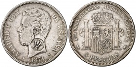 Resello falso del Gobierno Portugués, GP bajo corona. Aplicado sobre 5 pesetas de Amadeo I, 1871*1871 SDM. Al parecer este resello fue producido en la...