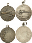Slg. Joos - Medaillen, Plaketten, Abzeichen der Luftfahrt 1783-1945
 Einseitige, versilberte Bronzemedaille o.J. (FD) Eindecker nach links in Wolken....