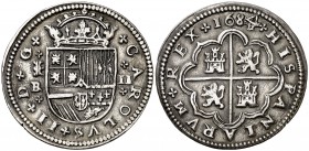 1684. Carlos II. Segovia. . 2 reales. (Cal. 642 var). 6,28 g. El 4 de la fecha rectificado sobre otro 4 girado. Leves rayitas. Buen ejemplar. Muy rara...