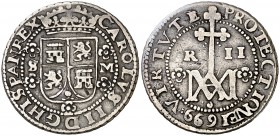 1699. Carlos II. Sevilla. M. 2 reales. (Cal. 653, mismo ejemplar). 5,40 g. Tipo "María". Orlas interiores. Valor: II. Leves golpecitos. Buen ejemplar....