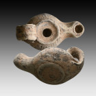 Ancient Terracotta Oil Lamp. 1st and 2nd century AD

Weight: 47.0 gr
Diameter: 89 mm