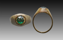 Ancient Bronze Ring with a stone on bezel. 7th and 12th century AD

Weight: 5.7 gr
Diameter: 24 mm