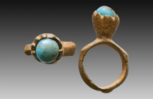 Ancient Bronze Ring with a stone on bezel. 7th and 12th century AD

Weight: 6.9 gr
Diameter: 32 mm