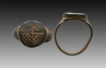 Ancient Bronze Ring with a decoration on bezel. 7th and 12th century AD

Weight: 7.1 gr
Diameter: 23 mm
