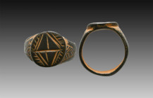 Ancient Bronze Ring with a decoration on bezel. 7th and 12th century AD

Weight: 6.5 gr
Diameter: 20 mm