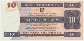 Pewex, 10 dolarów 1979 - HF - Rzadko notowany nominał. Złamany w pionie, rogi delikatnie nieświeże.&nbsp; Nieobiegowa prezencja. Papier z połyskiem.&n...
