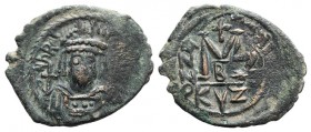 Heraclius (610-641). Æ 40 Nummi (33mm, 9.86g, 6h). Cyzicus, year 3 ? (612/3). Helmeted and cuirassed facing bust, holding globus cruciger and shield. ...