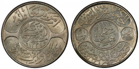HEJAZ: al-Husayn b. 'Ali, 1916-1924, AR 20 ghirsh, Makka al-Mukarrama (Mecca), AH1334 year 8, KM-30, bright white mint luster! PCGS graded MS63.
Esti...