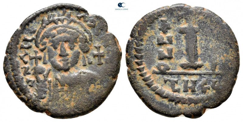 Justinian I AD 527-565. Theoupolis (Antioch)
Decanummium Æ

20 mm, 3,35 g

...