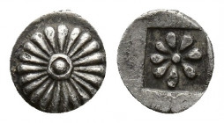 Greek Coins
IONIA, Erythrai AR Hemiobol. Circa 480-450 BC. Rosette/sunburst with central boss / Eight-rayed star within incuse square. Rare condition...