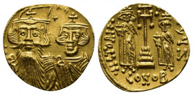 Byzantine
Constans II. AD 641-668. Byzantine Solidus AV dN CONSƮANVS, facing busts of Constans, on left with long beard, plumed helmet and chlamys, an...