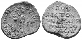 Byzantine Seal
Byzantine Lead Seal – 11th Century PB 
Obv: Standing figure, dressed as a bishop. He holds a globe cross in his right hand.
Back: 6 (si...