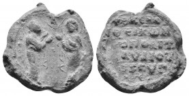 Byzantine Seal
Byzantine Lead Seal – 11th Century PB 
Obv: Two figures standing, both praying, both wearing halos.Back: 4 (four) lines of text.
Weight...