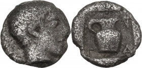 Greek Asia. Uncertain mint. AR Tetartemorion, c. 6th-5th century BC. Obv. Male head right. Rev. Oinochoe within incuse square. AR. 0.28 g. 7.00 mm. Li...