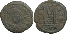 Justinian I (527-565). AE Follis, Constantinople mint, dated RY 19 (545/546). Obv. Helmeted and cuirassed bust facing, flanked by crosses. Rev. Large ...