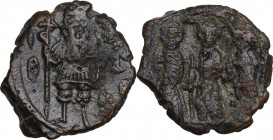 Constans II, with Constantine IV, Heraclius, and Tiberius (641-668). AE Follis, Constantinople mint. Obv. Constans standing facing in military attire,...
