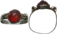 AR ring with garnet. Medieval period. Inner diameter 17 mm.