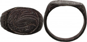 Bronze engraved ring, the bezel decorated with bird, floral decoration around. Medieval period. Size 17.50 mm.