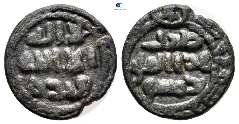 Umayyad Caliphate. Damascus . 
Fals AE

14 mm, 1,95 g

Legend in three line...