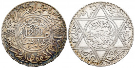 Morocoo. Al Hasan I. 10 dirhams. 1299 H (1881). Paris. (Km-Y8). Ag. 29,03 g. Iridiscent tone on obverse. XF. Est...40,00. 

Spanish description: Mar...