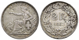 Switzerland. 2 francs. 1863. Bern. B. (Km-10a). Ag. 9,90 g. Nicks. Very scarce. Choice VF. Est...70,00. 

Spanish description: Suiza. 2 francs. 1863...