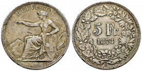 Switzerland. 5 francs. 1874. Brussels. B con punto. (Km-11). Ag. 24,90 g. Nicks. Rare. Choice VF. Est...90,00. 

Spanish description: Suiza. 5 franc...