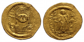Justinian I, 527-565. Solidus (Gold, 4.47 g. 21 mm), Constantinopolis, 545-565. 
D N IVSTINI...) Helmeted and cuirassed bust of Justinian facing, hold...