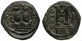 Justin II and Sophia AD 565-578. Nikomedia Follis ( 13.69 g. 30 mm)
Justin and Sophia seated on the throne, cross between their heads
Rev: large M, cr...